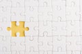 Top view flat lay of paper plain white jigsaw puzzle game texture incomplete or missing piece, studio shot on a yellow background Royalty Free Stock Photo