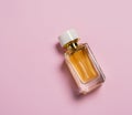 Top view flat lay perfume mock up bottle on a pastel pink background. Beauty and fashion. Copy space Royalty Free Stock Photo