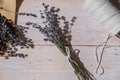 Top view flat lay of process making bouquets of dried lavender flowers. Cotton rope, scissors. Female do homemade herbs Royalty Free Stock Photo