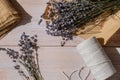 Top view flat lay of process making bouquets of dried lavender flowers. Cotton rope, scissors. Female do homemade herbs Royalty Free Stock Photo