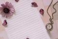 Top view flat lay shot of letter paper envelope and flower petals pocket watch Royalty Free Stock Photo