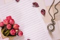 Top view flat lay shot of letter paper envelope and flower petals pocket watch Royalty Free Stock Photo