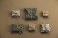 flat lay textile and kraft paper gift boxes on a brown background Royalty Free Stock Photo