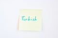 Top view flat lay of turkish language which written on the reminder notepaper