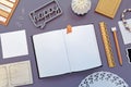 Top view flat lay with various neatly arranged desk with office supplies like pencils, ruler and open empty notebook Royalty Free Stock Photo