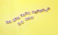 Flat lay of wooden letters BE THE BEST VERSION OF YOU on yellow background. Quote and motivation message Royalty Free Stock Photo