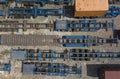 Top view of flatbed semi trailers and containers for rent stored in an empty dirt lot Royalty Free Stock Photo