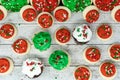 Top view flatlay of Christmas holiday treats - cupcakes and buttercream sugar cookies with sprinkles Royalty Free Stock Photo