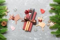 Top view of flatware tied up with ribbon on napkin on cement background. Close up of christmas decorations and reindeer. New Year