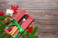 Top view of flatware tied up with ribbon on napkin on wooden background. Christmas decorations and reindeer with empty