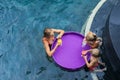 Top view of floating tray, family drinking in swimming pool Royalty Free Stock Photo