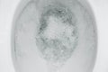 Top view, flushing water in the toilet close-up. Royalty Free Stock Photo