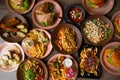 Top view of food on table in cafe. Pasta with shrimps. Caesar salad with croutons. Sandwiches with lettuce. Tomato soup. Royalty Free Stock Photo