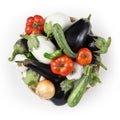 top view food white and black eggplants with tomatoes, zucchini, onion and garlic in wicker, basket isolated on white background