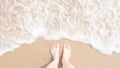 Top view foot on beach with Blur and soften Sea foam, Hipster style