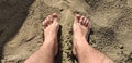 Top view of footprints of human feet on the warm sand of Tuscany