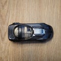 Top view of a Ford Fiesta Mattel Hot Wheels toy sport car model made of metal on a wooden surface