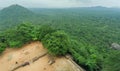 Top view on forest from the ancient Sigiriya rock with tourists and archeological area, Sri Lanka. UNESCO heritage site Royalty Free Stock Photo