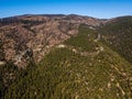 Top view on forested rocky hills landscape