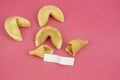 Top view fortune Cookie on a crimson background. Close-up of foreboding broken cookies with white piece of paper with copy space