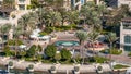 Fountain and palms timelapse at the Marina walk, During day time. Dubai, UAE