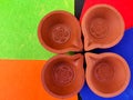 Top view of four clay lamps or diya or oil lamps Royalty Free Stock Photo