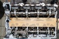 Top view of a four-cylinder engine with new camshaft dissembled and removed from car on a workbench in a vehicle repair workshop. Royalty Free Stock Photo