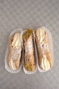 Top view of four delicious cannoli on wooden background Royalty Free Stock Photo