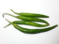 Top view of four fresh long green jalapeno chili peppers isolated on white a background Royalty Free Stock Photo