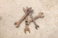 Top view group old rusted spanner wrenches Mechanic tool on grey concrete background