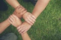Top View Four hands Diverse multiethnic Partner team together. Close up Teamwork group of Four multiracial people join hands Royalty Free Stock Photo