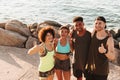 Top view of four happy fitness people standing on pier Royalty Free Stock Photo