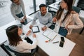 Top view. Four people are working in the office together Royalty Free Stock Photo