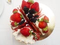 Top view of four pieces of fresh yummy cake with fruits