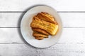 Top view of FranzbrÃÂ¶tchen pastry on plate on rustic white wooden table Royalty Free Stock Photo