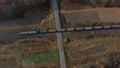 Top View Freight Train Passing Railway Crossing. Aerial Drone View Flight Over Royalty Free Stock Photo