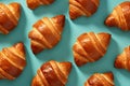 Top view of French Croissant pastries on pastel background