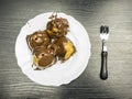 Top view of a French dessert - Profiterole on a plate.