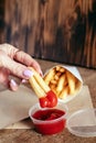 Top view of French fries. The concept of fast food, quick bites and restaurants for catering. Potatoes in carton and ketchup. Royalty Free Stock Photo