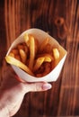 Top view of French fries. The concept of fast food, quick bites and restaurants for catering. Potatoes in carton and ketchup. Royalty Free Stock Photo