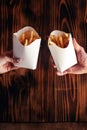 Top view of French fries. The concept of fast food, quick bites and restaurants for catering. Potatoes in carton and ketchup. Royalty Free Stock Photo