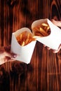 Top view of French fries. The concept of fast food, quick bites and restaurants for catering. Potatoes in carton and ketchup. Royalty Free Stock Photo