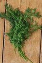 Top view fresh bunch dill rustic wooden table close up Royalty Free Stock Photo