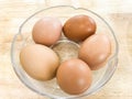 5 fresh chicken eggs in glass bowl for cooking Royalty Free Stock Photo