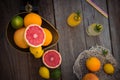 Top view Fresh citrus fruits in vintage scale and several oranges, lemons, grapefruit, lime and lemonade bottles on the old rustic Royalty Free Stock Photo