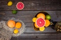 Top view Fresh citrus fruits in vintage scale and several oranges, lemons, grapefruit, lime on the old rustic wooden table with a Royalty Free Stock Photo