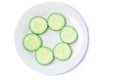 Top view of fresh cucumber slices on white plate or dish isolated on white background with clipping path Royalty Free Stock Photo