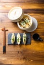 Top view  fresh dumplings with wooden steamer on stone black slate. Chinese food on rustic old vintage wooden background Royalty Free Stock Photo