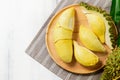 Top view of Fresh durian monthong on wood dish and white wood