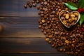 Top view of fresh and fragrant coffee beans lovingly laid out in the shape of a heart on a brown wooden background